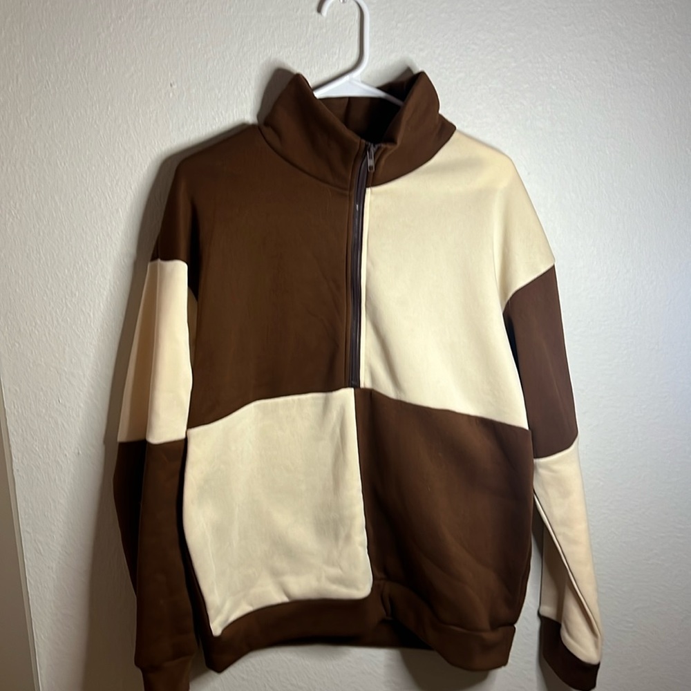 Double colored half zip jacket. Worn once!